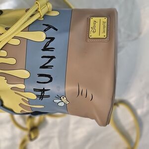 Loungefly Tan and Yellow Backpack with Playful Design